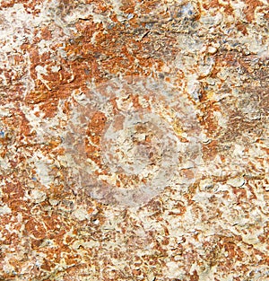 rocks stone a nd red orange gneiss in the wall of morocco