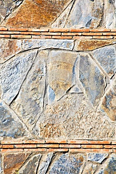 rocks stone and red gneiss in the wall of morocco