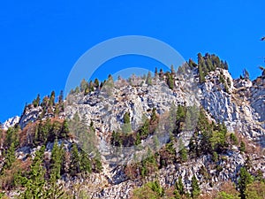 Rocks and stones of the Churfirsten mountain range and in the Alpine mountains over Lake Walensee, Walenstadtberg