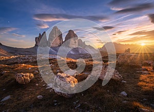 Rocks and stones at colorful sunset in autumn in Tre Cime