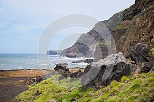 Rocks and stones near a stormy sea or ocean. Beautiful landscape.
