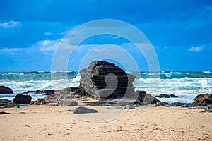 Rocks at surfer beach Praia do Castelejo near Sagres