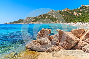 Rocks in water on beachRocks on beautiful Roccapina beach, Corsica island, France
