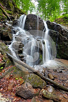 Rocks in waterfall stream. beautiful nature scenery in forest. cascade of rapid mountain river