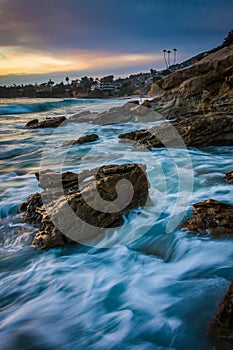 Rocks and waves in the Pacific Ocean at sunset