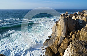 Rocks and waves of surf in the ocean near Cabo Carvoeiro, Peniche peninsula, Portugal