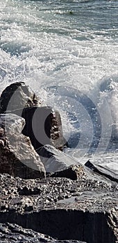 rocks and waves, winter and wind harshness.