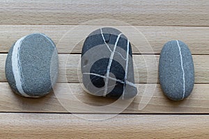 Rocks on the wooden table. Pebbles. Asian culture, traditions.