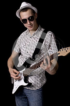 Rockstar with glasses holding a guitar
