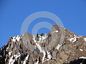 Rocky alpine mountain peak Le Chamossaire located in a mountain massif of the Bernese Alps Alpes bernoises, Villeneuve VD photo