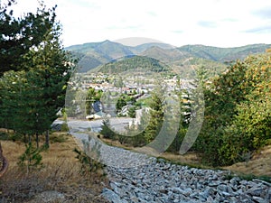 A rocky artificial riverbed leads to the north side of Kellogg, Idaho.