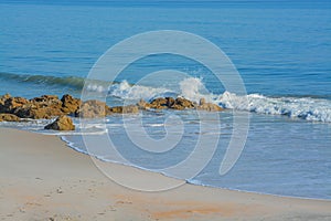 The rocky Atlantic Coast, at Marineland Beach in Marineland, Flagler County, Florida photo