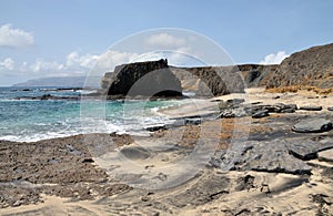 Rocky bank leading to bay