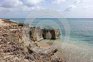 A rocky beach with clear turquoise water in Stuart, FL