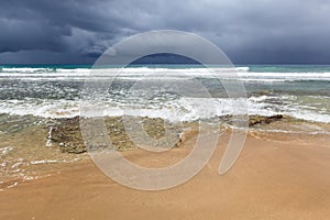 Rocky beach and coming storm