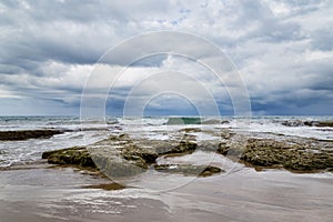 Rocky beach and coming storm