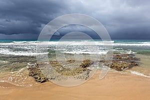 Rocky beach and coming storm