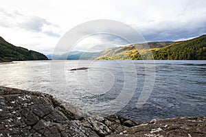 The rocky beach at Elgol on the Isle of Skye in Scotland. minimalist Scottish landscape of a misty morning on a calm, Loch Fada la