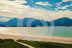 Rocky beach in evening. Beach with white sand