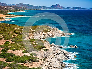 Rocky beach formed by large boulders in the north of Sardinia, Italy