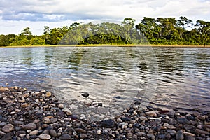 Rocky beach on the Napo River photo