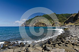 Rocky beach ner Porto da Cruz at northern coast of Madeira island, Portugal