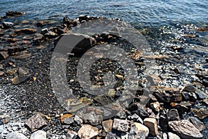 A rocky beach next to a body of water