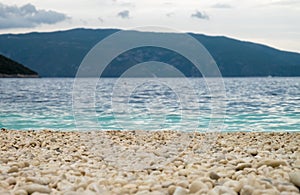 Rocky beach, sea, mountain and sky