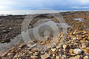 Rocky beach. sky withe clouds