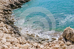 Rocky Beach with Stones and Clear Blue Water in the Mediterranean Sea. Demre, Turkey