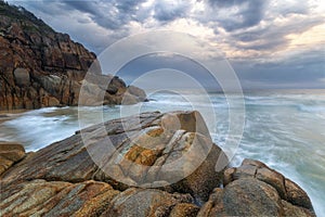 a rocky beach on stormy day in South West Rocks in Australia