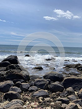 A rocky beach on a sunny day in Rhode Island