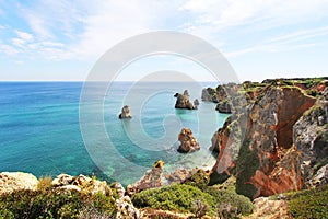 Rocky beach at sunset, Lagos, Portugal. Counter light