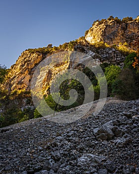 Rocky Blanc-Martel trail leading to rugged cliffs under sunlight in La Palud-sur-Verdon, France
