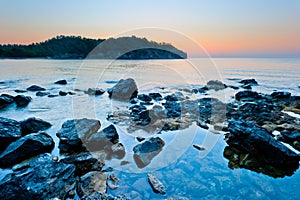 Rocky bottom of the sea and the sunrise