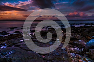 Rocky boulders on shore of ocean