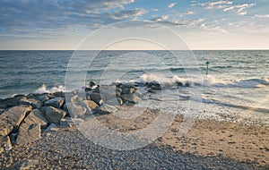 Rocky Breakwater at Sunset in Wales