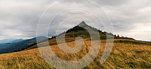 Rocky Cierny kamen hill from hiking trail bellow Ploska hill in Velka Fatra mountains in Slovakia