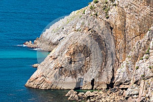 Rocky cliff with arches near Playa del Silencio Asturias, Spain