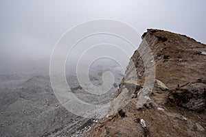 Rocky cliff over Ngozumpa glacier in Nepal