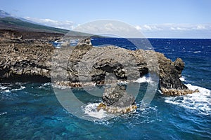 Rocky cliff on Pacific ocean.