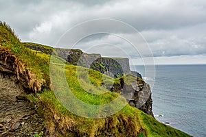 Rocky cliffs along the coastal walk route from Doolin to the Cliffs of Moher