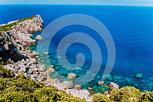 Rocky cliffs at mediterranean sea coast. Beautiful sea view coastline, vast seas