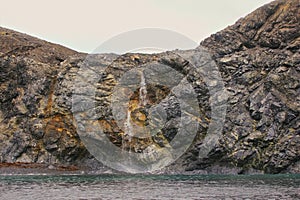 Rocky cliffs of Novaya Zemlya archipelago in