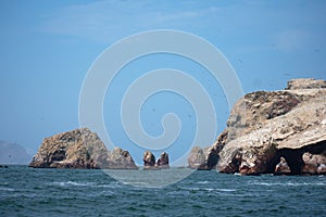 Rocky cliffs poking out of the coean Las Islas Ballestas Paracas Peru