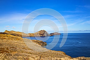 Rocky cliffs on the shore of the island of Madeira, Portugal. This amazing place is Ponta de Sao Lourenco. The most beautiful