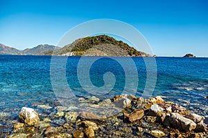 Rocky coast of the Aegean Sea in Icmeler, Turkey. Large stones.