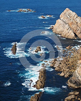 Rocky coast with blue sea and waves