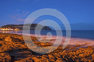 Rocky coast in front of Praia da Luz in the Algarve