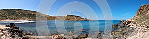 Rocky coast of Ghajn Tuffieha panorama, Malta photo